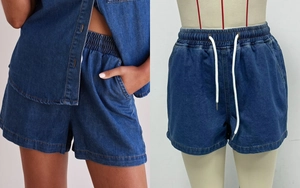 Detail of blue denim shorts showing elastic waistband and white cotton drawstrings