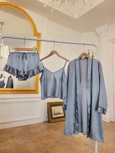 Three-piece satin sleepwear set in misty blue with elegant silk texture and lace details