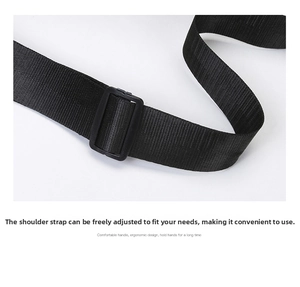 Adjustable black nylon shoulder strap detail with durable plastic buckle for travel bags