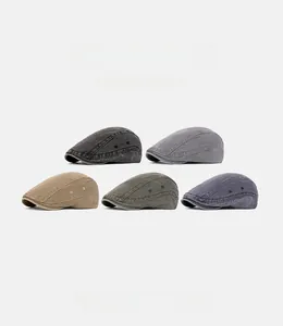 Collection of washed canvas berets in five colors including charcoal, khaki, and olive green