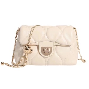 Elegant cream quilted leather handbag with gold chain strap and spherical charm detail