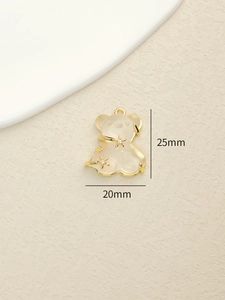 Detail view of a resin bear pendant with star zircon inlay and 25mm x 20mm dimensions