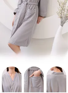 Detail shots of grey waffle bathrobe featuring a classic kimono collar and white piping trim