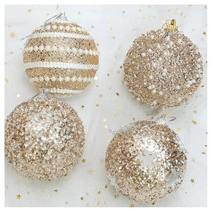 Detail of champagne gold Christmas ornaments with pearls and glitter on star mesh fabric