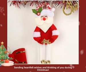 Detail of plush Santa pendant with long white rope legs and small golden bells