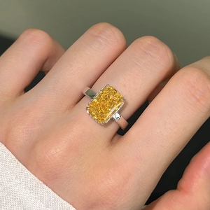 Macro detail of high carbon radiant cut yellow zircon ring with silver plating