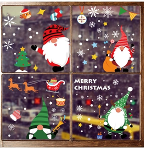 Detail of Santa and reindeer window stickers with Merry Christmas text on glass