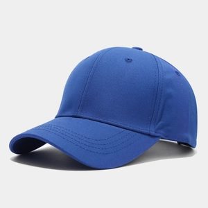 Detail shot of a royal blue six-panel baseball cap with textured twill fabric and eyelets