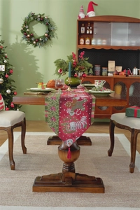 Detail of Christmas table runner with gingerbread man patterns and tassel fringe decor