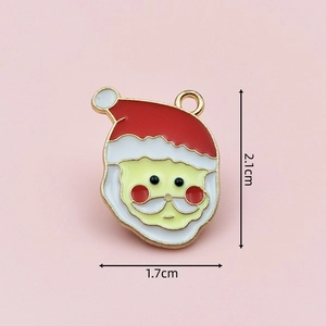 Detail view of Santa Claus enamel charm with 2.1cm x 1.7cm dimensions on pink background