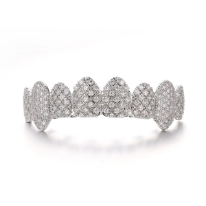 Detailed view of silver hip hop iced-out teeth grillz with shiny zircon stones