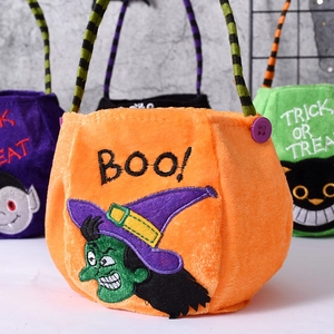 Detail of Halloween candy bags with embroidered witch and vampire felt patterns