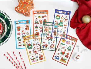 Detail of Christmas PET stickers with Santa and reindeer among festive decorations
