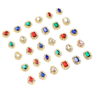 Abalorios de lujo para uñas con cristales coloridos y marcos de aleación dorados
