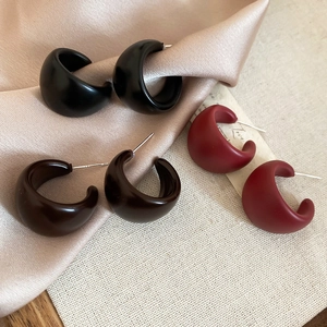 Three pairs of C-shaped acrylic earrings in black, dark coffee, and matte red colors