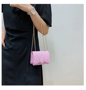 Pink heart-shaped buckle crossbody bag with gold chain and V-pattern stitching