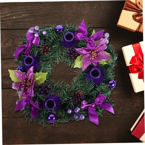 Christmas Advent wreath with purple poinsettias, ribbons and four candle holders