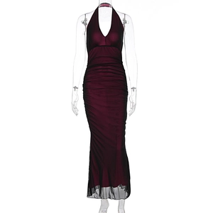 Detail view of ruched burgundy mesh dress with black overlay and fishtail hemline