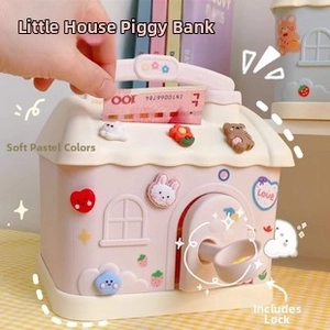 Detail of house-shaped piggy bank showing coin slot and hand inserting money