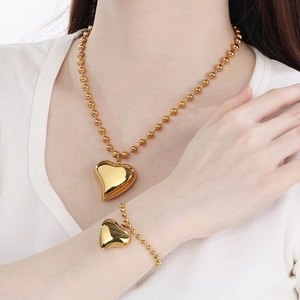 Elegant gold stainless steel heart pendant jewelry set with beaded necklace and bracelet