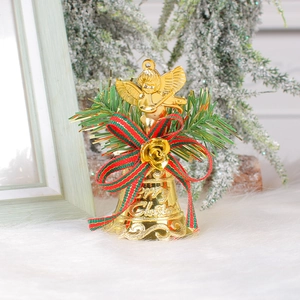 Golden Christmas bell with violin angel, festive red plaid bow and pine branches