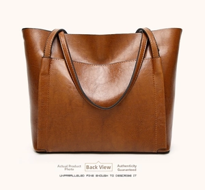 Detailed back view of the brown oil-wax leather tote bag showing smooth texture