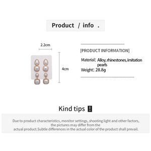 Detailed view of long drop earrings with dimensions 4cm x 2.2cm and rhinestone accents