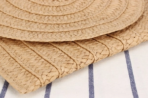 Macro view of woven straw texture with natural wood color and tight spiral stitching
