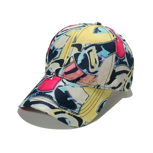 Detail view of colorful abstract graffiti baseball cap with multi-color geometric prints