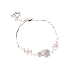 Elegant silver bracelet with gourd pendant, bow-knot and zircon inlay on white background