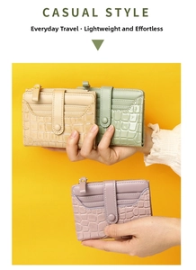 Detail showing crocodile texture and multiple card slots on compact women's wallets