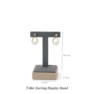 Detail of gray T-shaped earring stand with wooden base and 10.5cm height measurements