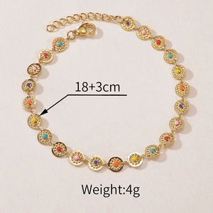 Detail of 18k gold plated titanium bracelet with colorful beads and lobster clasp closure