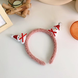 Detail of pink fleece Christmas headband with cute 3D snowman and red sequin hats