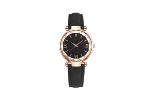 Close-up of starry black dial with rose gold case and multi-faceted glass on women's watch