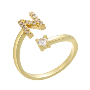 Detail of adjustable gold ring with micro-pave letter N and a round zircon stone
