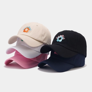 Detail of multi-color cotton baseball caps with studio floral embroidery and metal buckle