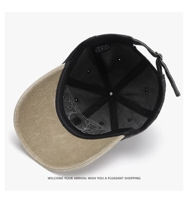 Detail view of cotton baseball cap interior featuring adjustable metal buckle and wash label