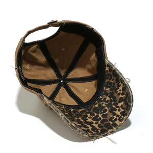 Detail of vintage cotton baseball cap with leopard print brim and internal cotton labels