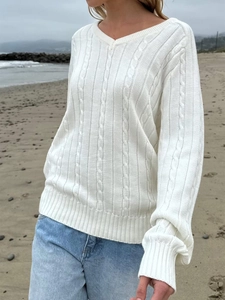 Women's white V-neck cable knit sweater in a loose casual style for autumn and winter