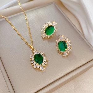 Elegant gold titanium steel jewelry set featuring green gemstone necklace and earrings