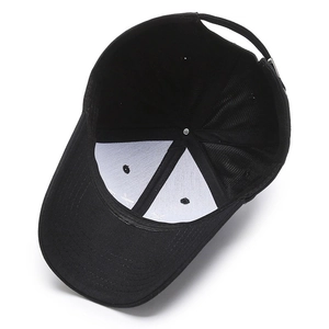 Internal view of black baseball cap showing white support lining and stitching