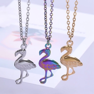 Three flamingo stainless steel pendants in gold, silver and rainbow colors on O-chains