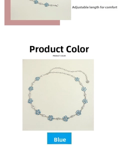 Detailed view of silver chain belt featuring translucent blue flower charms and clasp