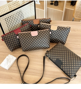 Detailed overhead view of assorted mini crossbody bags with digital prints and leather trim