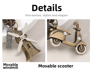 Detail of vintage bronze windmill and scooter alloy pendants with movable parts