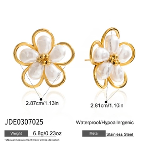 Detailed view of gold flower earrings with opal petals and dimensions listed