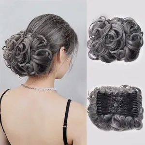 Detail view of silver grey synthetic hair bun extension with comb for secure volume styling