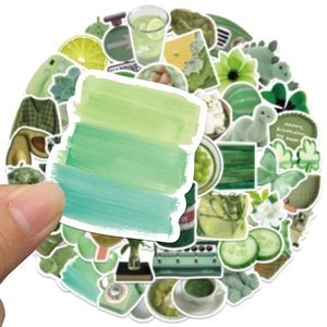 Macro detail of avocado green aesthetic stickers showing watercolor brush strokes and patterns