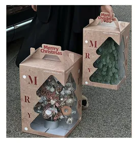 Close-up of Christmas tree gift boxes with Merry Christmas print and handle